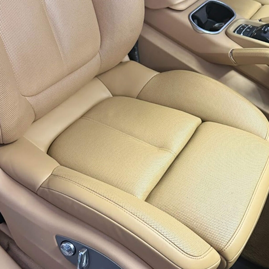 Porsche Cayenne tan leather seat after repair and cleaning