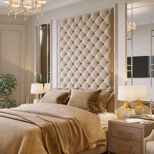 Classic tufted upholstered wall panels used as a decorative feature behind the bed