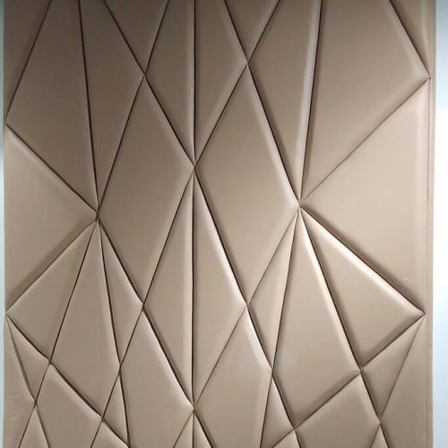 Custom geometric upholstered wall panels with a modern angular design